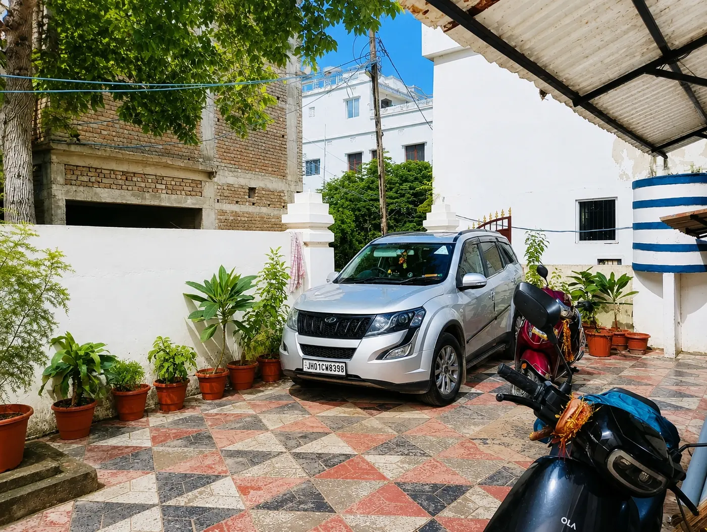 Parking space with car at Yostel Venus